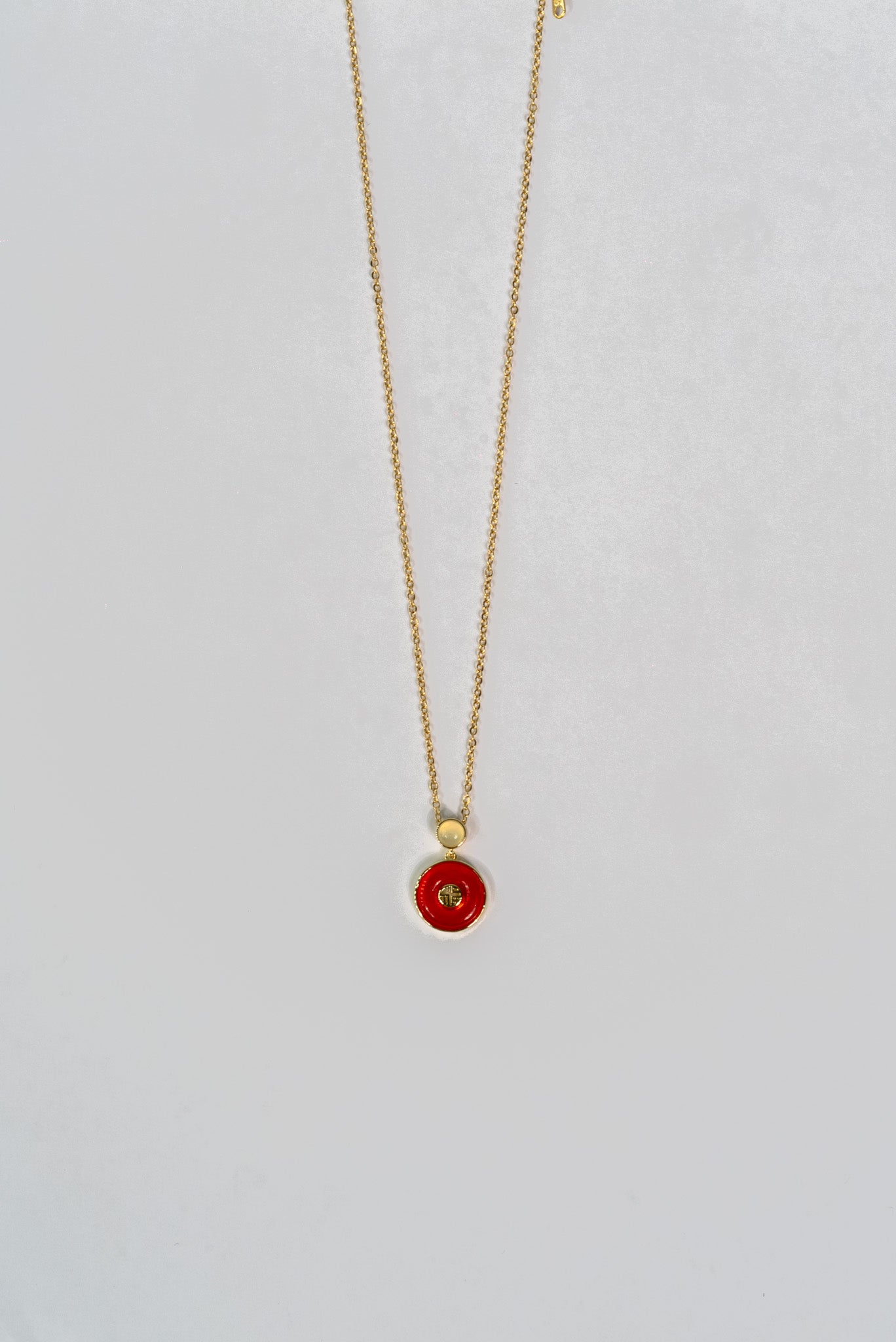 Elegant Gold Pendant Necklace with Red Enamel Detail